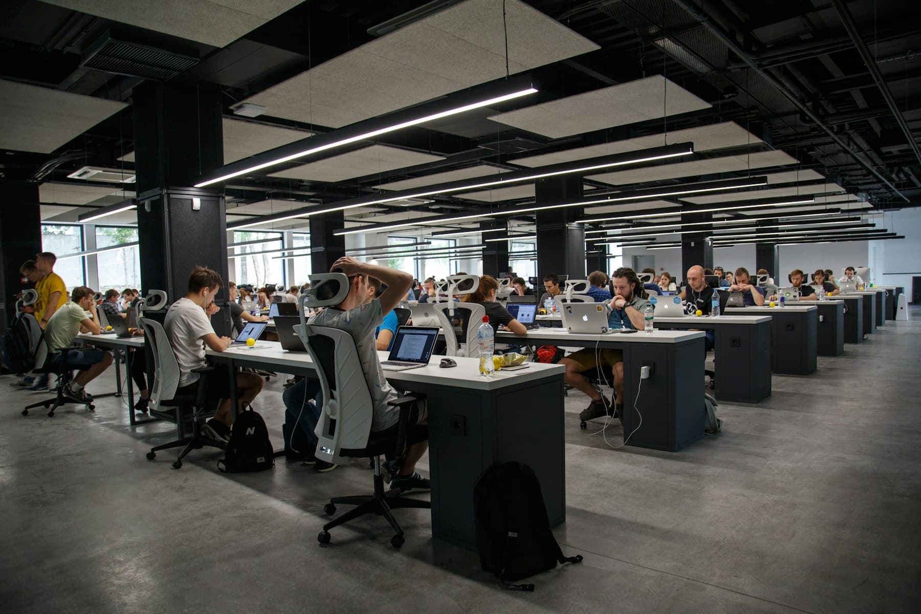 A large open-plan office full of people at desks, the scale of team that enterprise AI training for GCCs serves